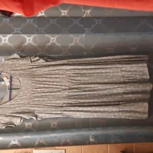 Mint green with a hint of a pretty light blue and white flowers has a slip under